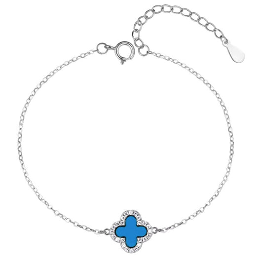 le bracelet Melina Cœur Bleu, en acier inoxydable plaqué or blanc 18 carats, doté d'un pendentif en forme de cœur bleu serti de cristaux.